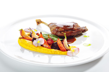 Fried Duck Leg with Young Vegetables, Flowers and Carrot Cream