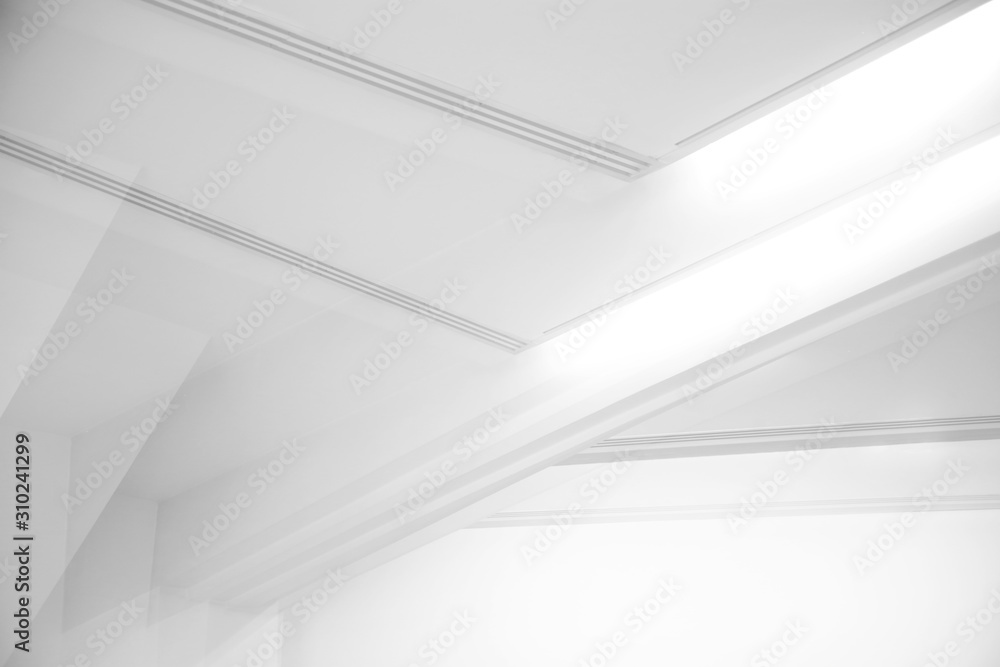 Poster ceiling and glowing girders with lamps. abstract architecture fragment. modern office building inter