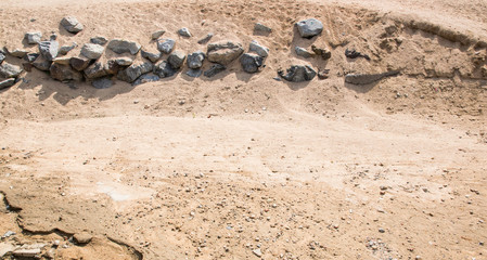 Sand and stones on the sand beach.