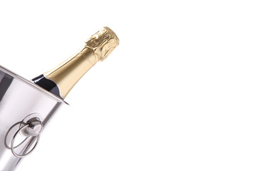 Bottle of champagne in metal bucket isolated on white background