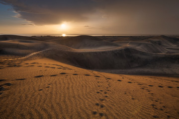 Fototapeta na wymiar Maspalomas dunes in sunrise light in Gran Canaria in Canary Islands.