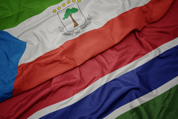 waving colorful flag of gambia and national flag of equatorial guinea.