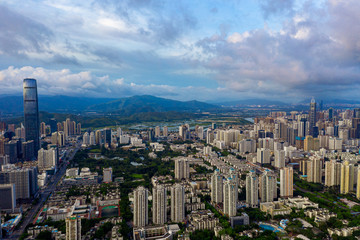 an aerial view of shenzhen city at a summer sunrise with cloudscape in the air