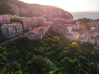 Aerial view on the center of Sorrento city, sunset, houses and streets, sea views and a Vizuvius,...