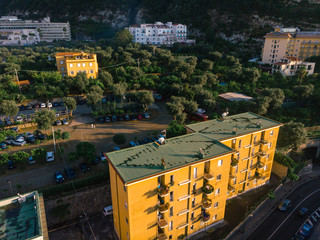 Aerial view on the Sorrento city streets, sunset, houses and Hotels, mountains and buildings in the...