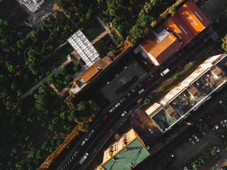 Aerial view on the Sorrento city streets, sunset, houses and Hotels, mountains and buildings in the distance. Travel and vacation concept on Italy. Infrastructure, cars and parking place