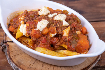 Italian poutine with baked parsnip fries