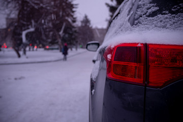 The car after a snow storm. Snowstorm in the city