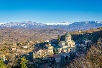 View of the monastery Gelati and mountains with snow, Imereti, Georgia