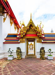 Wat Pho temple in Bangkok city, Thailand. View of pagoda and stupa in famous ancient temple. Religious buildings in buddhism style near Grand Palace. Oriental and Asian style, famous tourist target.