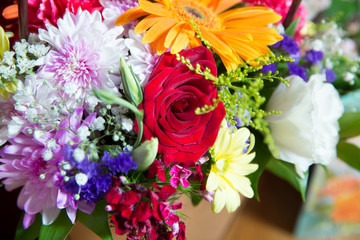 Red flower picture close up in the bouquet. The flower's petal . Bouquet of fresh red, white , orange roses . bouquet of multicolored roses .