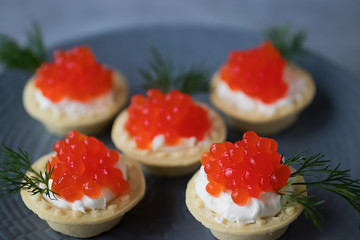 Tartlets with red caviar.