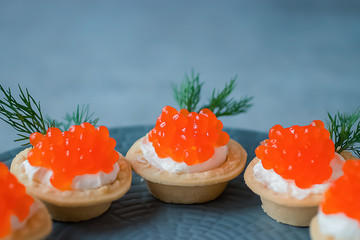 Tartlets with red caviar.