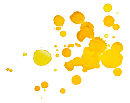 yellow specks droplets, splashes of paint on paper. on white background