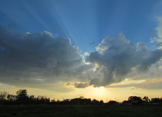 Landscape with sky,  dramatic clouds and sun      