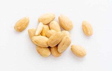 A handful of raw natural hazelnuts on white background