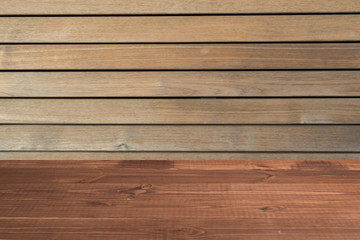 Wooden table in front of a blurred background. Perspective brown wood with a blurry background of nature or park - can be used to showcase or assemble your products. Mock up to display the product.