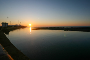 Fototapeta na wymiar Sunset at the seaport on The black sea coast, Sochi, Russia