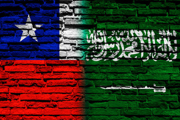 Flag of Chile and Saudi Arabia on brick wall