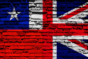 Flag of Chile and England on brick wall