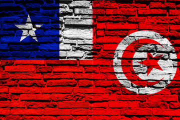 Flag of Chile and Tunisia on brick wall
