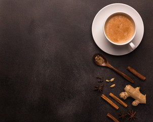 traditional indian drink masala tea on a dark background with copy space, top view