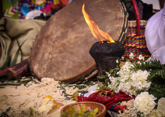 Celebration on the beach of young girls hippies. Sacred music and ancestral instruments. Spiritual ceremony and aura reading