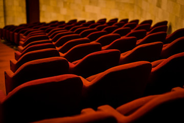 Empty Red Chairs in Theatre