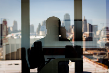 Reflection of Cityscape in Office Building