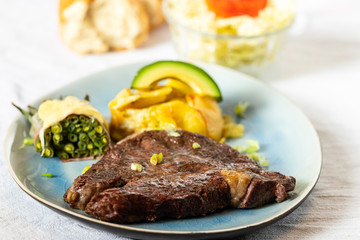 grilled steak with potato gratin