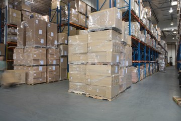 Boxes Stacked In Warehouse