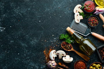 Food background. Spices, herbs and kitchen tools. Top view. free space for your text. Rustic style.