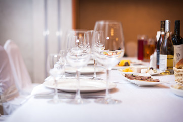 Empty wine glasses set in the restaurant.
