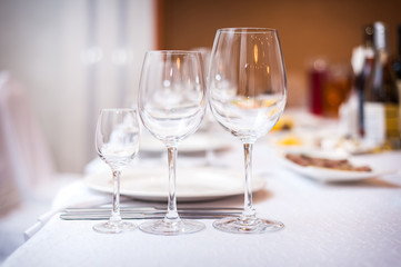 Empty wine glasses set in the restaurant.