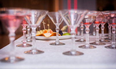 Luxury Banquet table with a pyramid of champagne glasses with cherries.