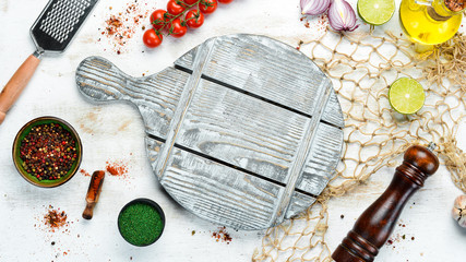 Food banner. Spices, vegetables and herbs on a white wooden background. Top view. free space for your text. Rustic style.