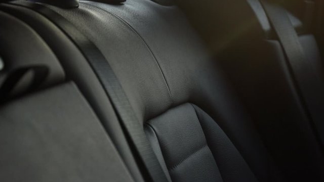Close up Brown leather rear seats in a premium SUV.