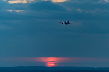 Fototapeta na wymiar View of airplane going up against beautiful sky