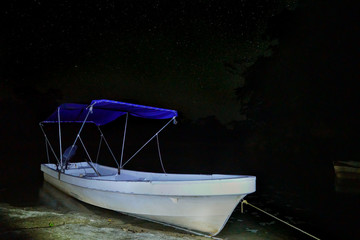 Boat in the river with a starry night