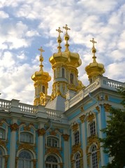 Fototapeta na wymiar Golden domes with crosses of the Catherine Palace Church in Pushkin (Tsarskoye Selo), a suburb of St. Petersburg, Russia. Russian royal tourist attractions, travelling. Famous excursion place.