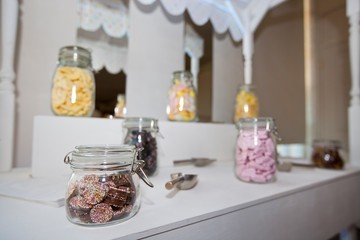 Close-up view of confectionary in glass jars