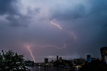 Naklejka na ściany i meble Lightning during thunderstorm in the sky. Natural phenomenon of