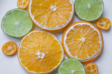 Obraz premium Classic shot of citrus fruits in the kitchen on white background