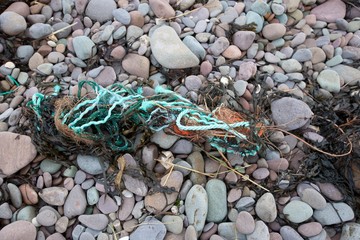 Fishing refuse litters a beach