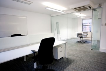 Office desk with meeting room in background