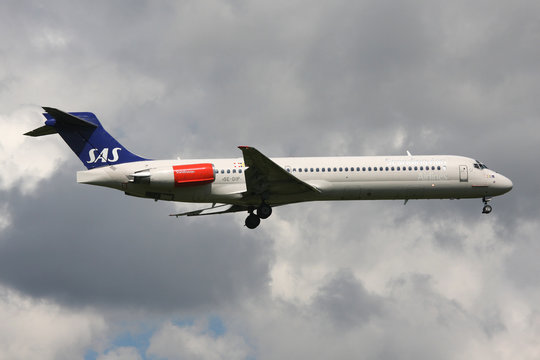 DRAG&Oslash;R, DENMARK - JUNE 21, 2010: Scandinavian Airlines SAS McDonnell Douglas MD-87 with registration SE-DIP on short final for runway 04L of Copenhagen Airport, Kastrup.