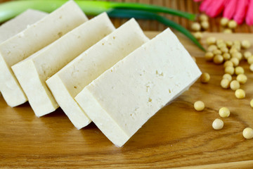 Sliced tofu on wood cutting board