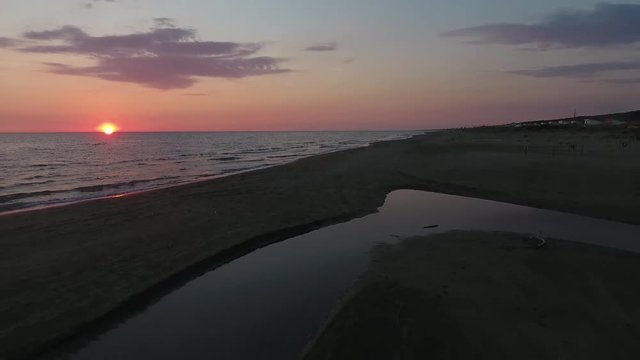 Sunset at the beach in Italy from a drone point of view