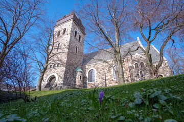 Fototapeta na wymiar historical stone church in Alesund, Norway, Scandinavia on a calm and clear sunny day in spring 