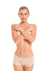 Obraz premium Beautiful young woman in underwear on white background